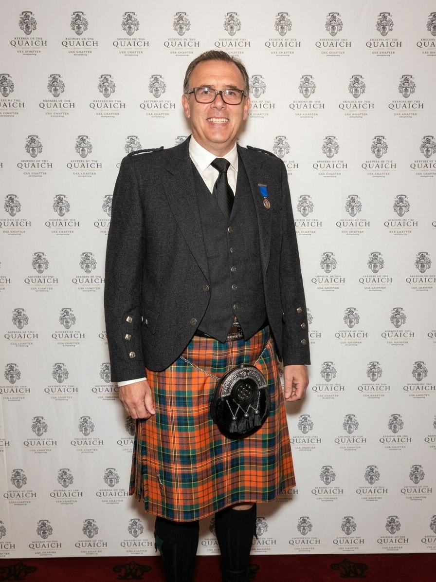 Gregor Cattanach in full Highland dress at the Keeper of the Quaich ceremony, wearing kilt and medal